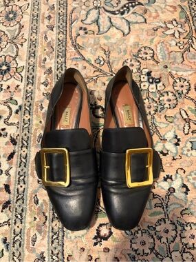 Bally Black Leather Janelle Loafers with Gold Buckle